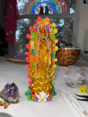Golden Virgen de Guadalupe statue