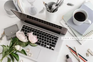 Laptop, Coffee & Peonies on Grey Workspace. Stock Image