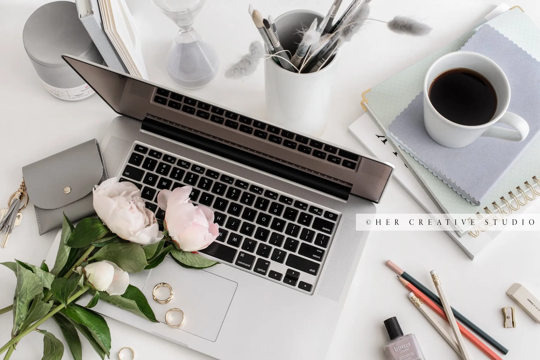 Laptop, Coffee & Peonies on Grey Workspace. Stock Image