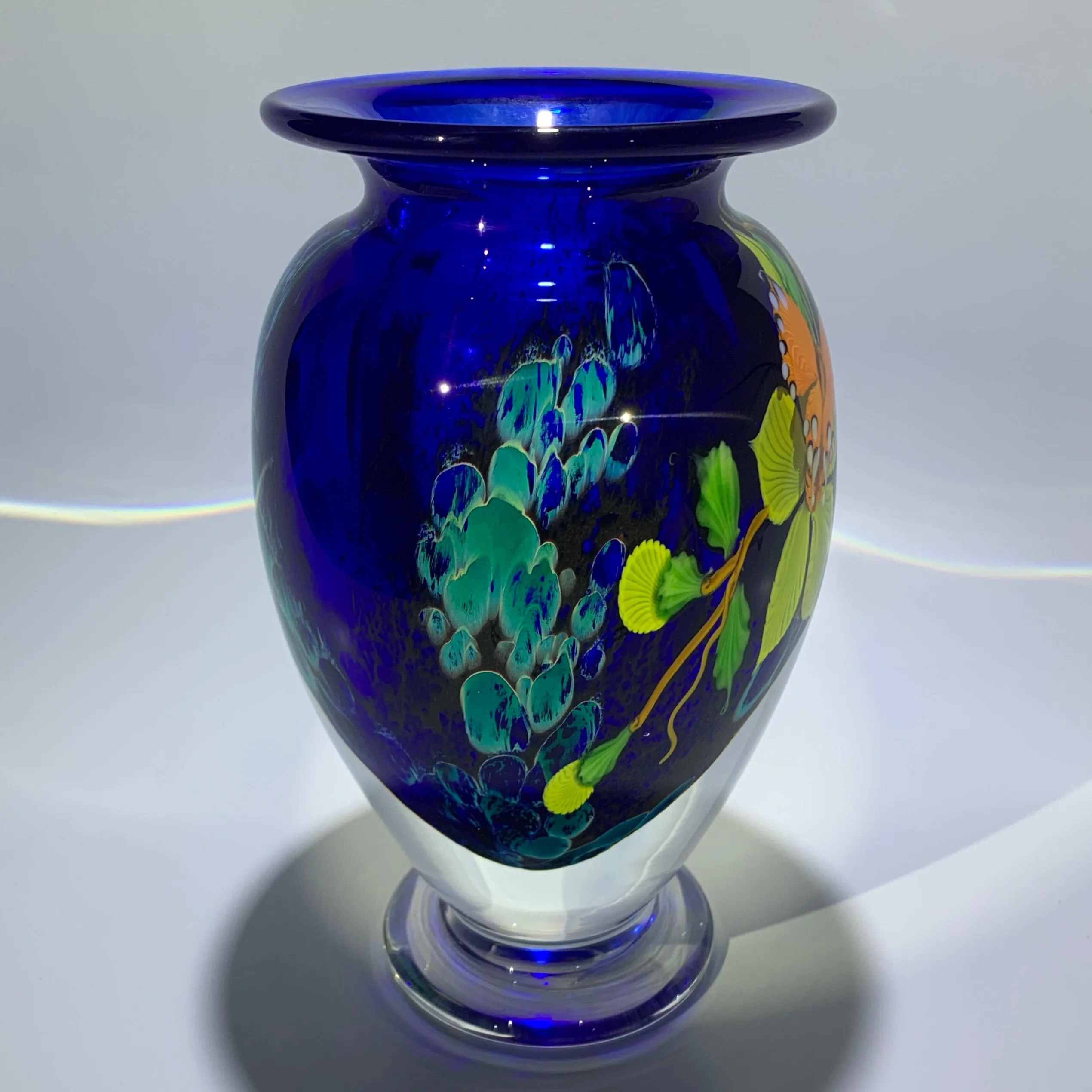 Mayauel Ward 2019 Compound Torchwork Orange Swallowtail Butterfly with Yellow Blossoms on Blue