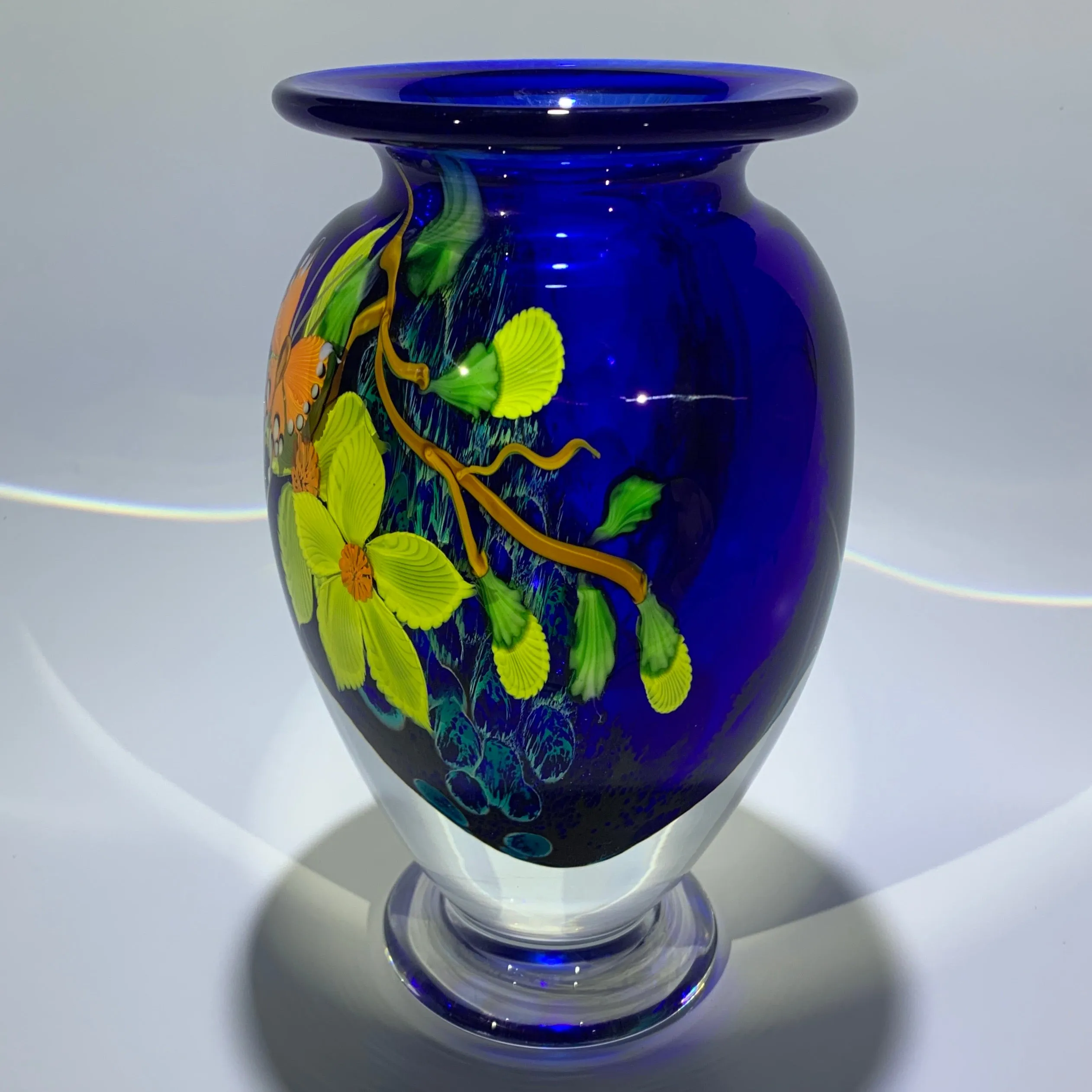 Mayauel Ward 2019 Compound Torchwork Orange Swallowtail Butterfly with Yellow Blossoms on Blue