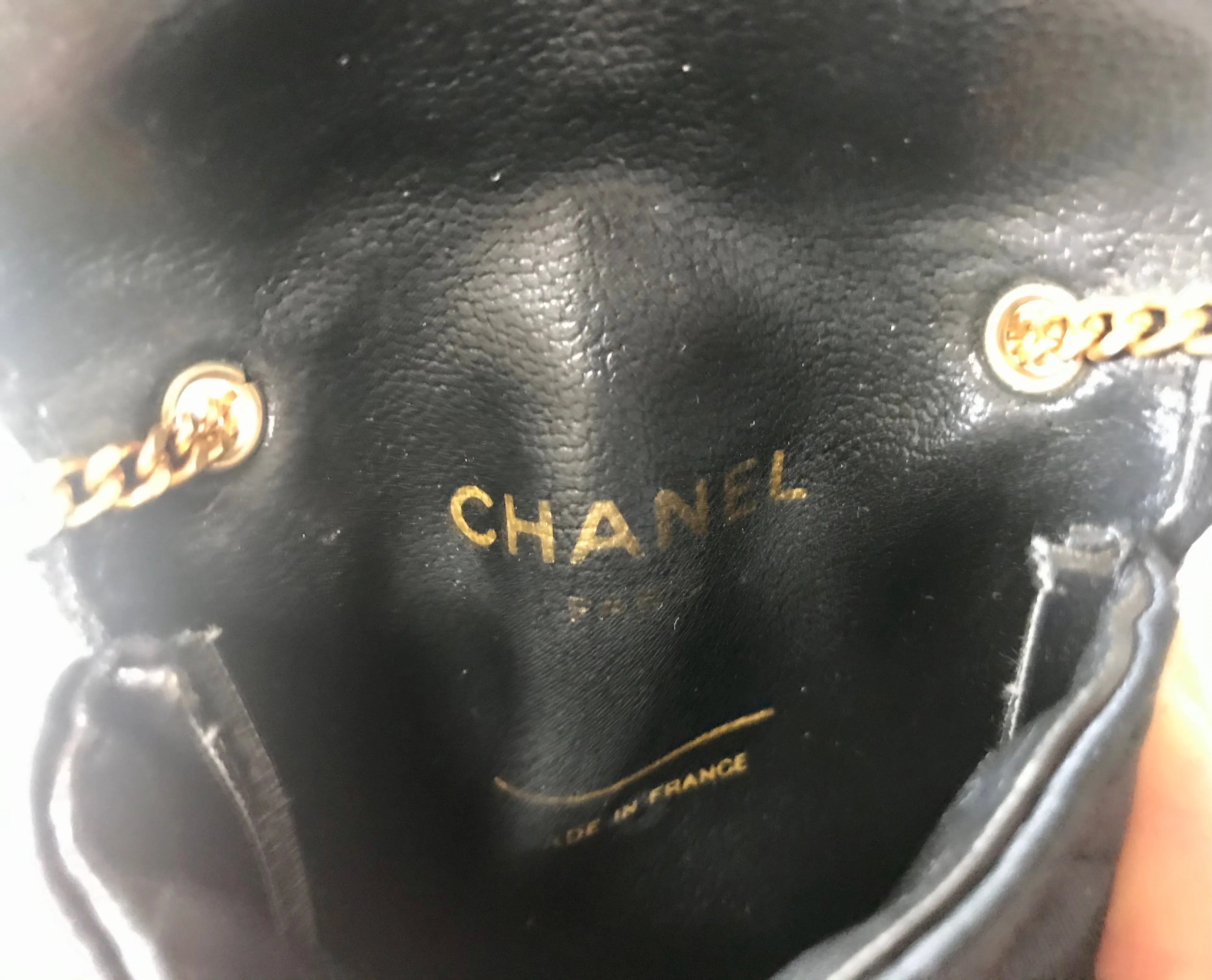 Vintage Chanel black quilted satin fabric mini pouch, coin purse, long necklace with golden chain and CC motif. Fiocci snap. 060516re2