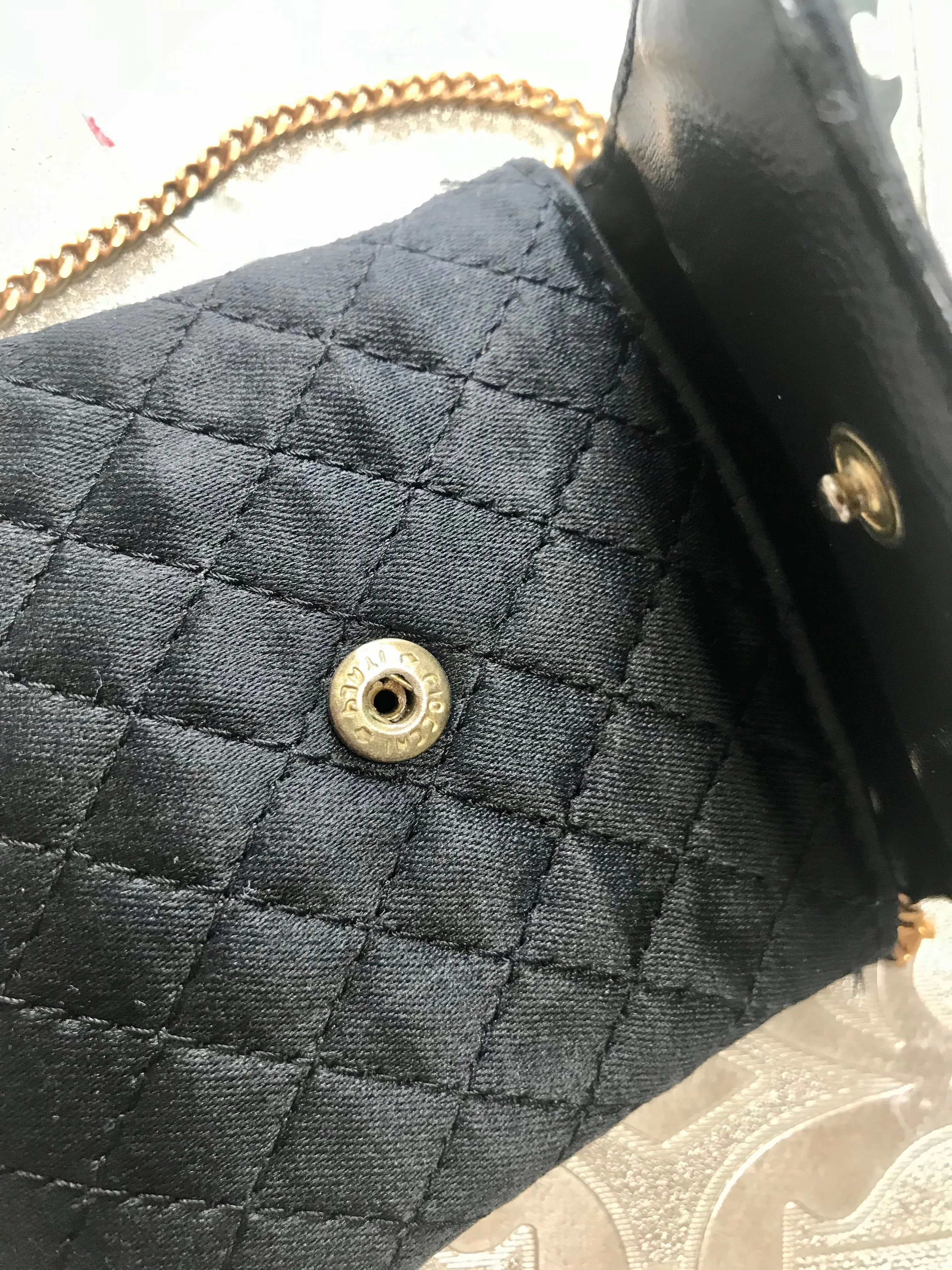 Vintage Chanel black quilted satin fabric mini pouch, coin purse, long necklace with golden chain and CC motif. Fiocci snap. 060516re2